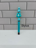 Stylet perlé - Silicone turquoise avec perle florale