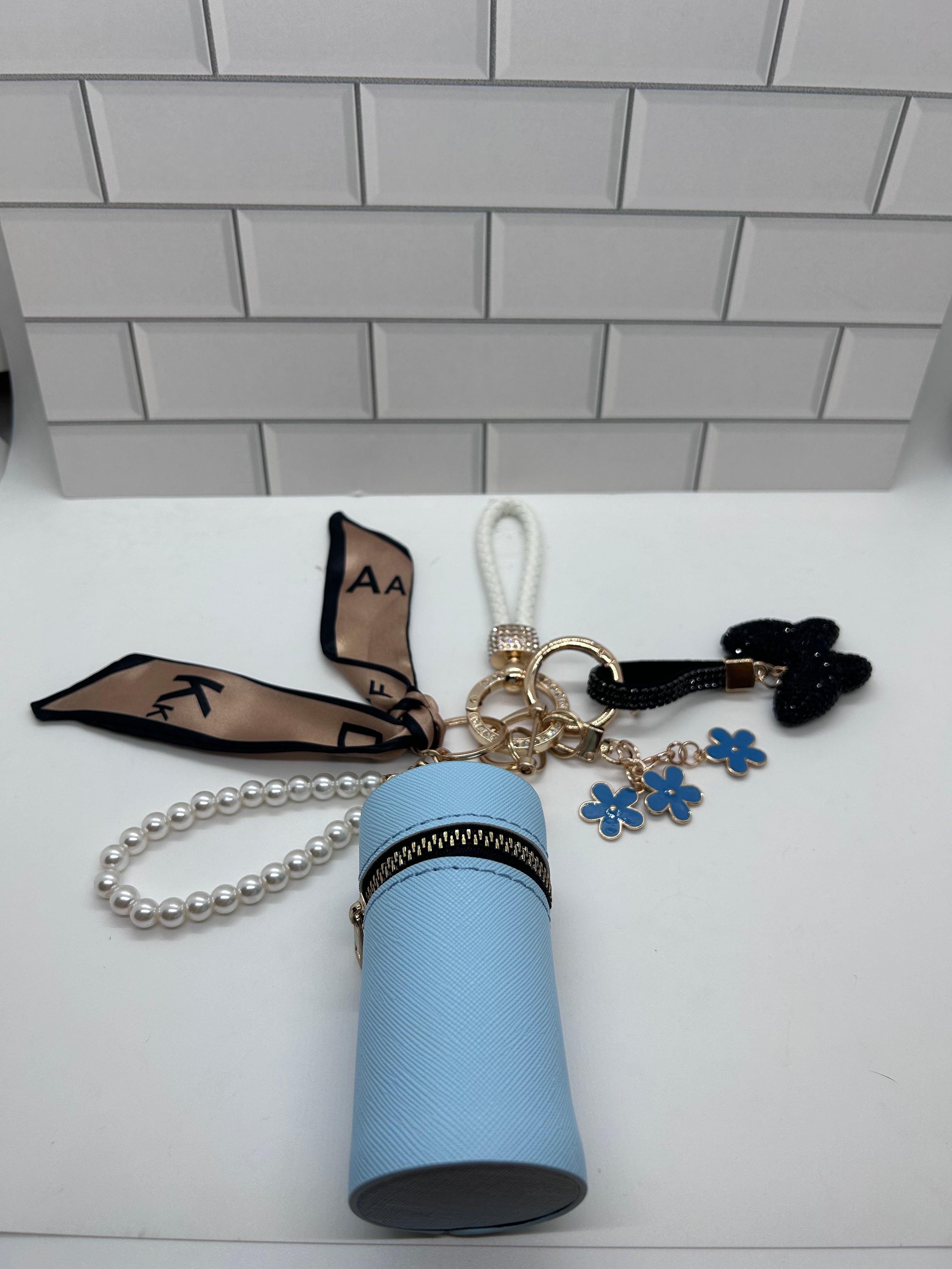 White Wristlet Keychain Bundles-Blue Cylindrical Bag, Blue Charms, Black Butterfly Charm