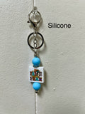 Porte-clés en silicone avec perles et motif chrétien