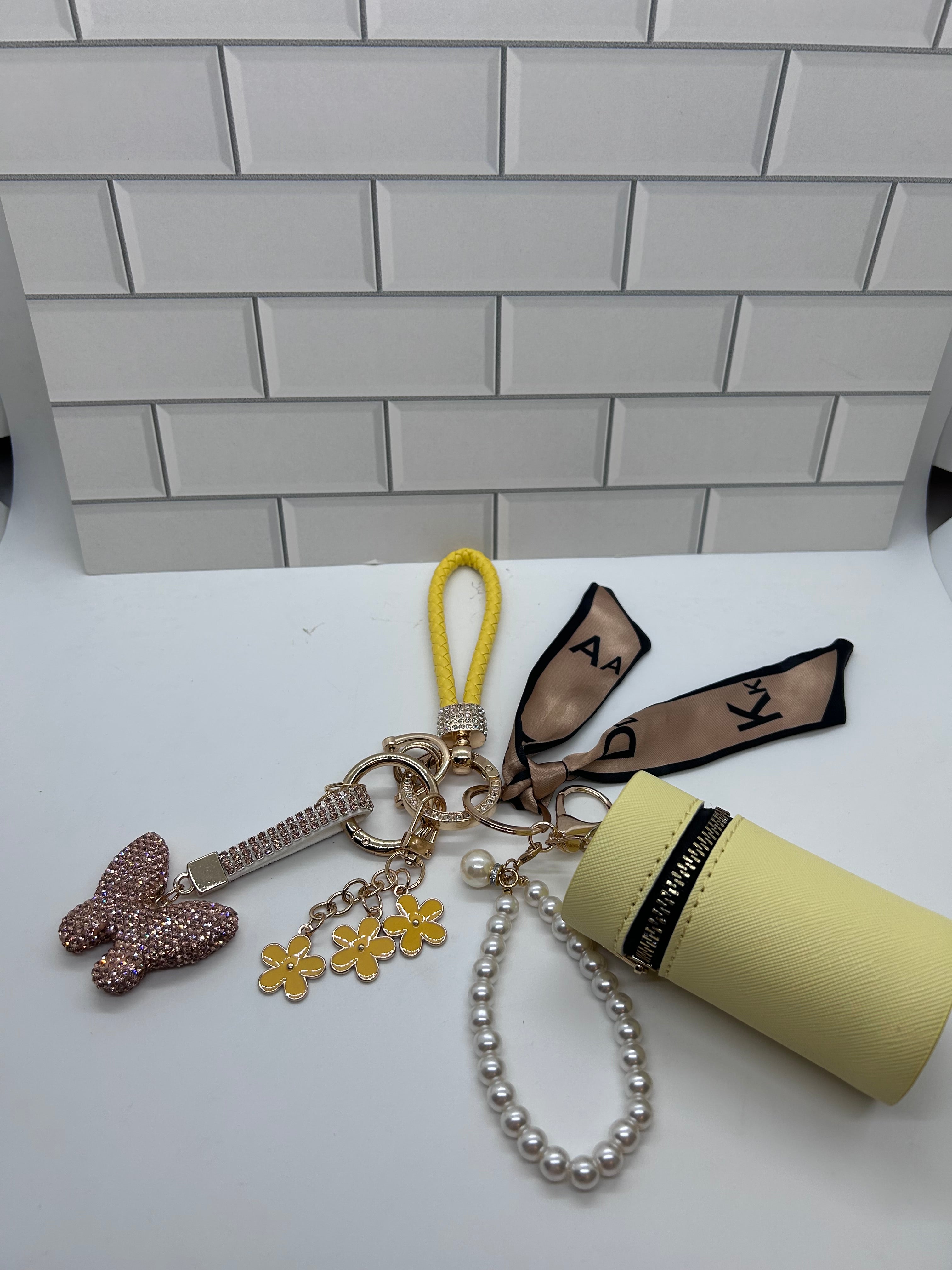Yellow Wristlet Keychain Bundles-Yellow Cylindrical Bag, Yellow Charms, Champagne Butterfly Charm