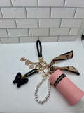 Black Wristlet Keychain Bundles-Orange Cylindrical Bag, Orange Charm, Black Butterfly Charm