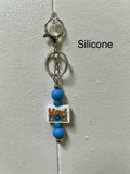 Porte-clés en silicone avec perles et motif chrétien