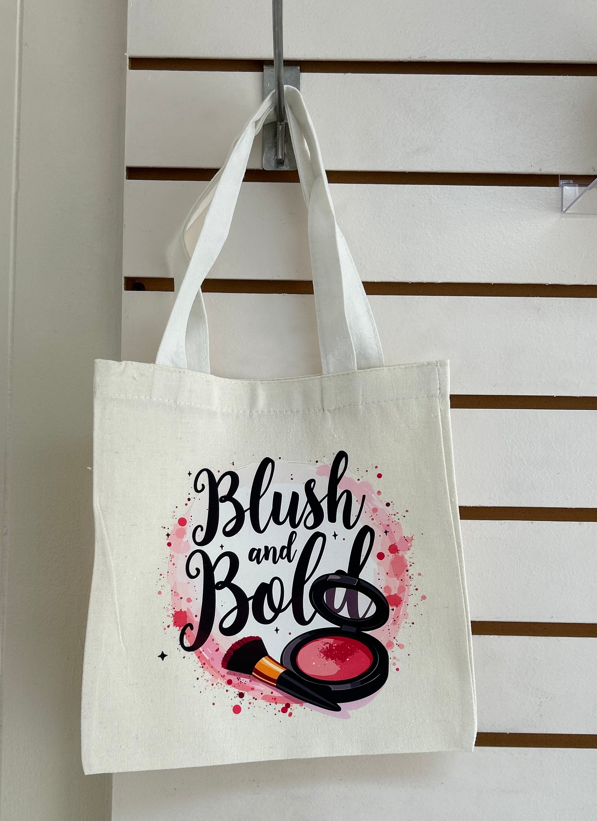 Mini sac fourre-tout en toile avec poignées blanches, orné d'un magnifique motif de maquillage. 25x25 cm