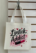 Mini sac fourre-tout en toile avec poignées blanches, orné d'un magnifique motif de maquillage. 25x25 cm