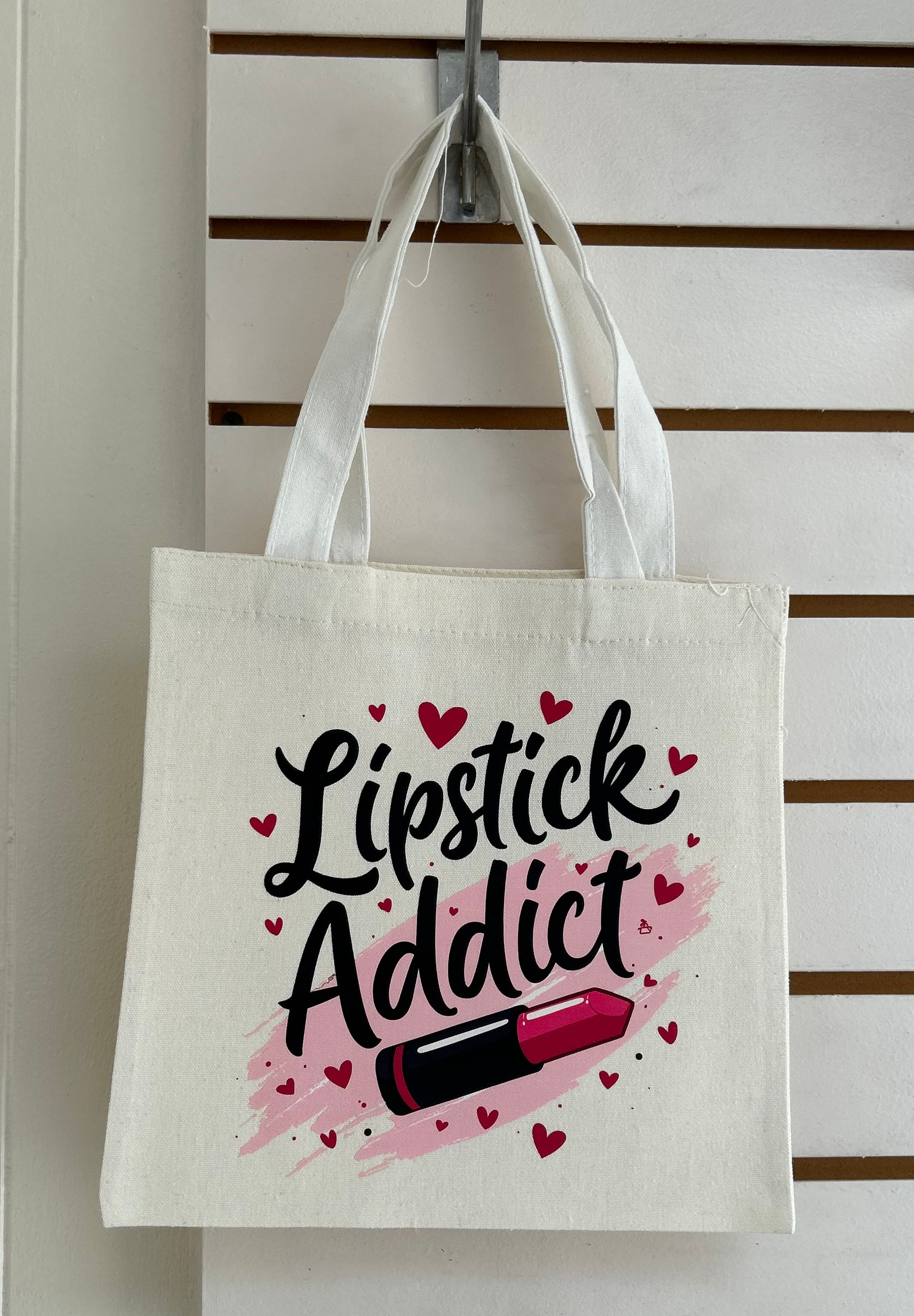 Mini sac fourre-tout en toile avec poignées blanches, orné d'un magnifique motif de maquillage. 25x25 cm