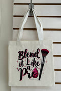 Mini sac fourre-tout en toile avec poignées blanches, orné d'un magnifique motif de maquillage. 25x25 cm