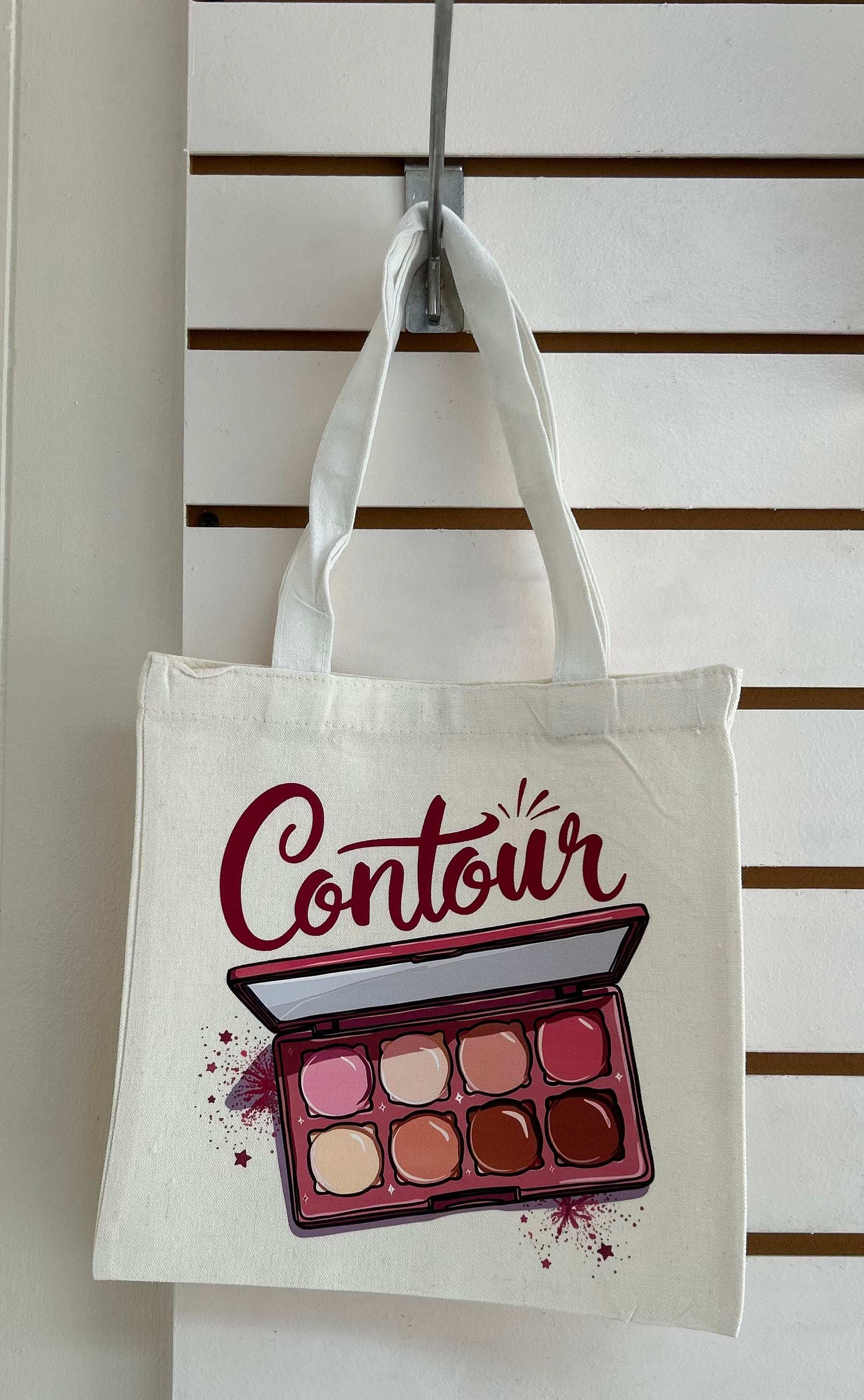 Mini sac fourre-tout en toile avec poignées blanches, orné d'un magnifique motif de maquillage. 25x25 cm
