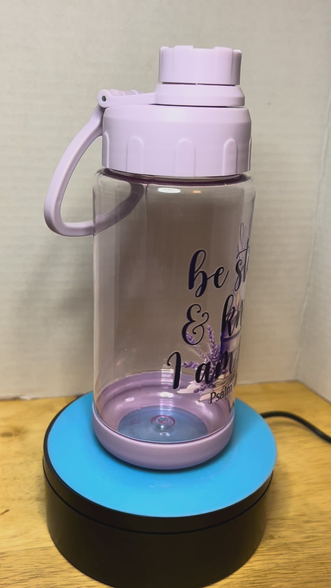 14 oz Plastic Water Bottle with Handle and Screw on Lid featuring a Beautiful Design